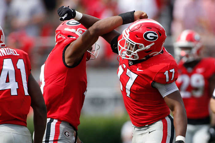Georgia inside linebacker Nakobe Dean (17) celebrates with Georgia outside linebacker Nolan Smith (4) after getting a sack during the second half of an NCAA college football game between Arkansas and Georgia in Athens, Ga., on Saturday, Oct. 2, 2021. Georgia won 37-0. News Joshua L Jones Syndication Online Athens
